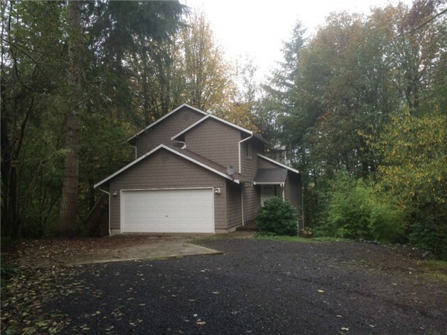 Property Photo:  7110 Camus Rd NW  WA 98502 