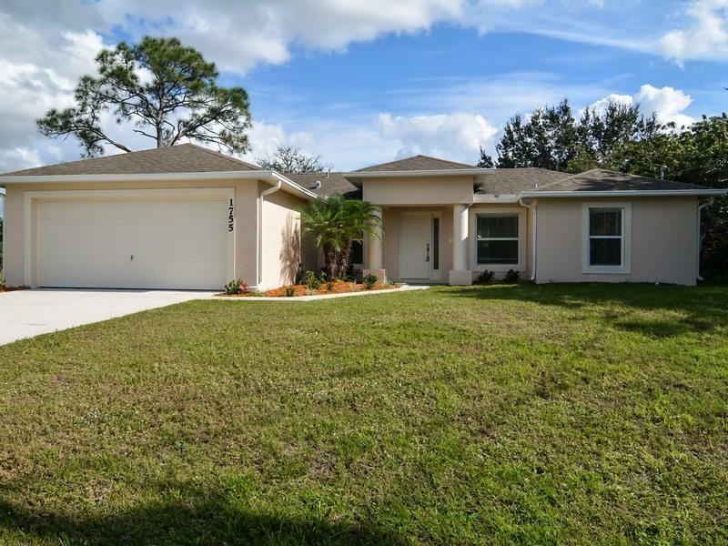 Property Photo:  1755 SW Import Drive  FL 34953 