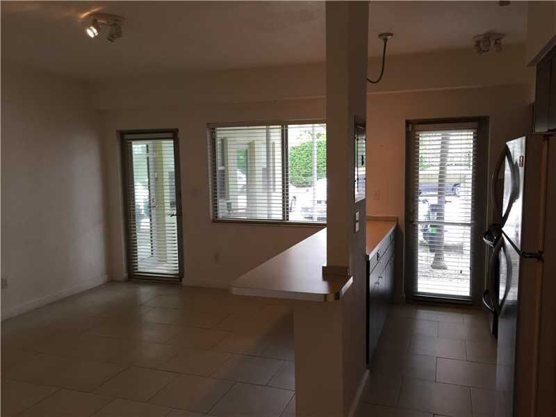 Property Photo: 6835 Rue Versailles 104 FL 33141