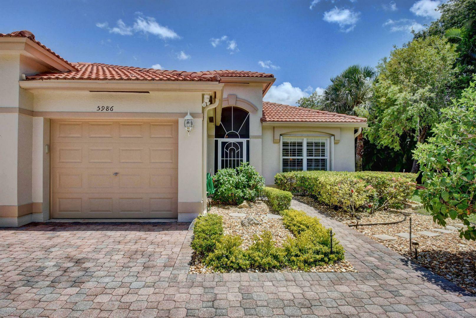 Property Photo:  5986 Cocowood Court  FL 33437 