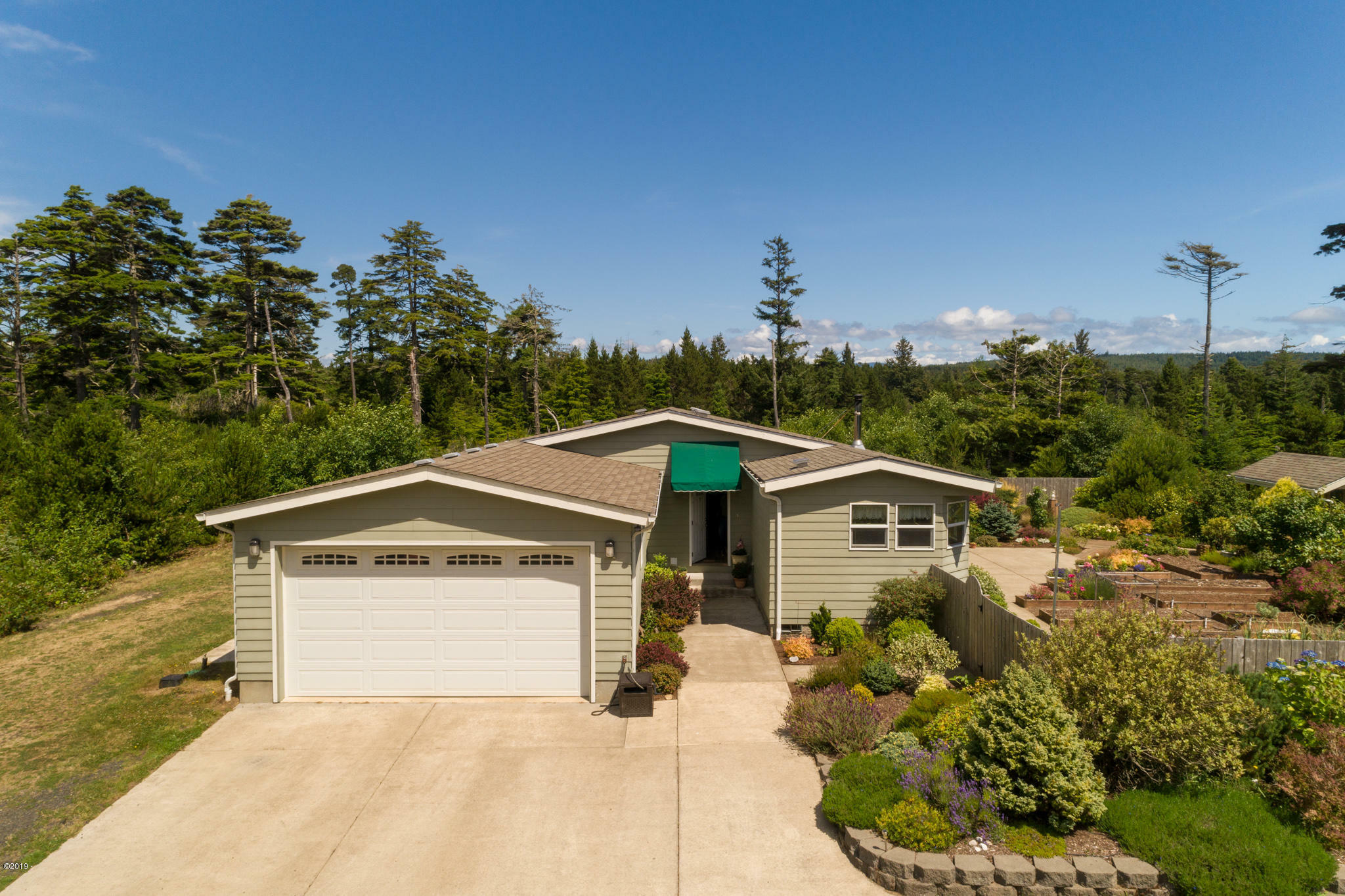 Property Photo:  8715 NW Seal Rock St  OR 97376 