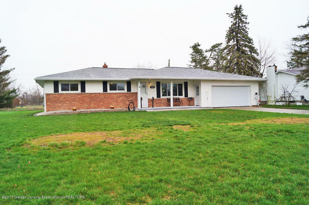 Property Photo: 727 Arbor Vitae Drive MI 48917