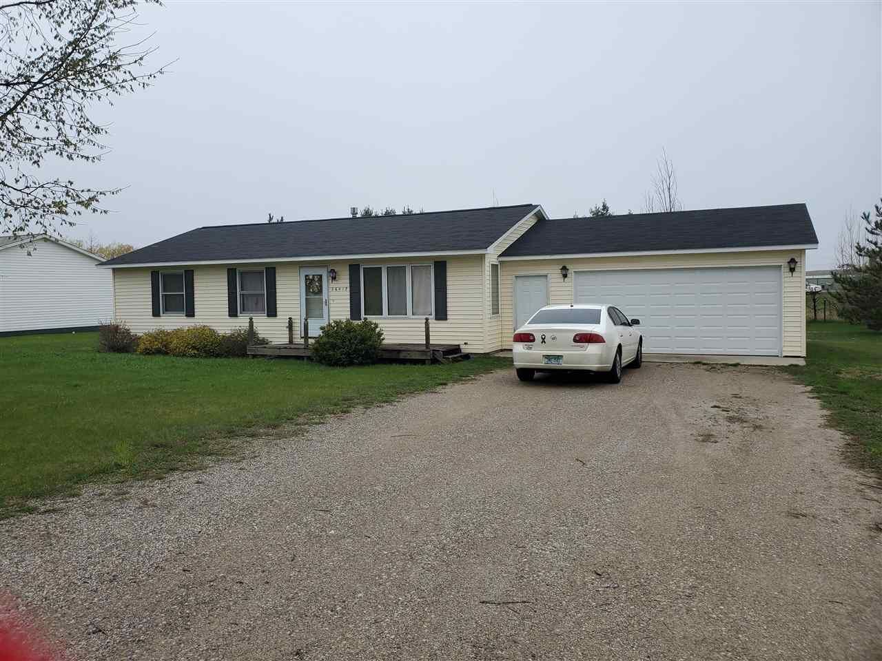 Property Photo:  06417 Old US 31  MI 49720 