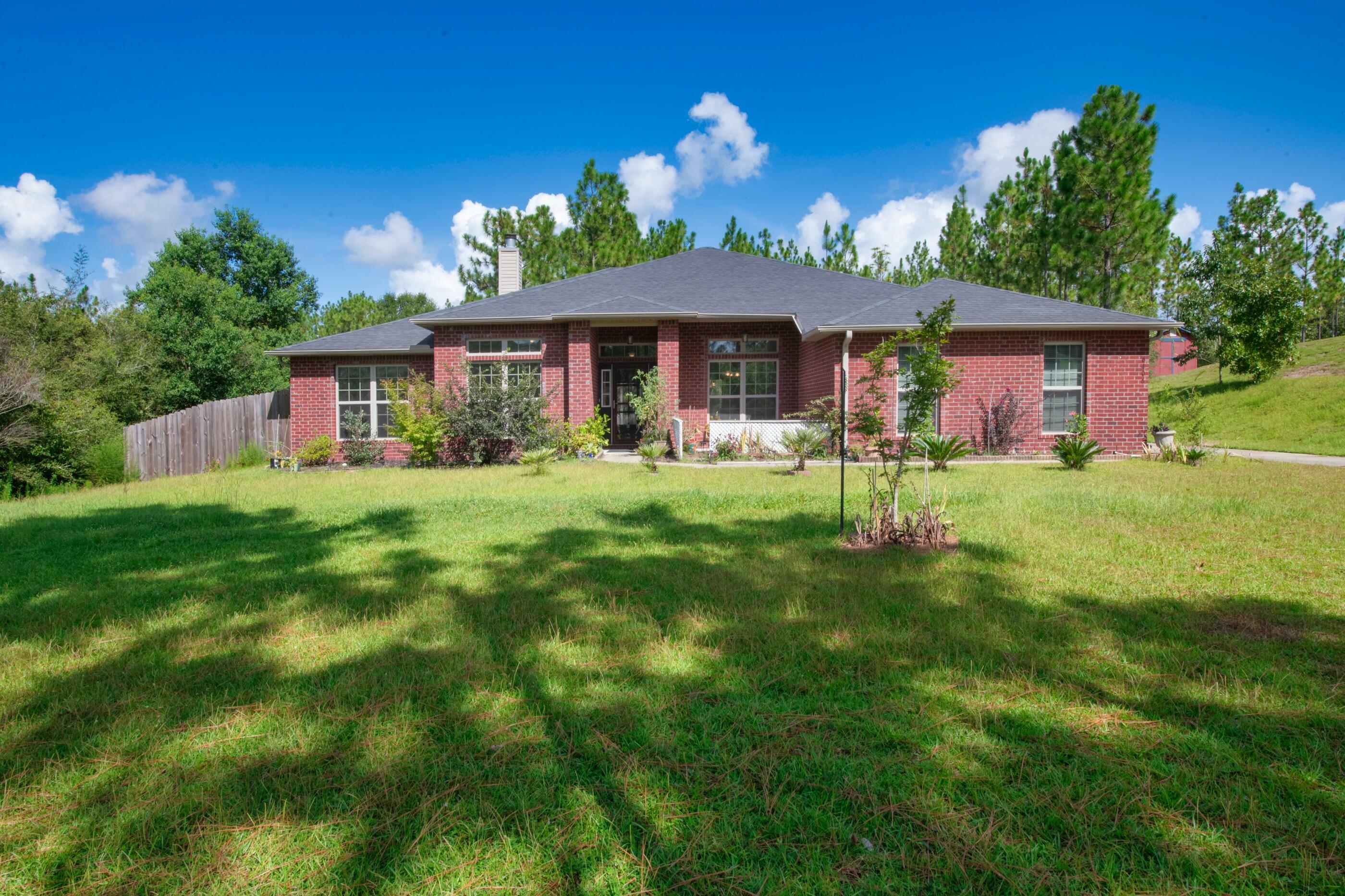 Property Photo:  6406 Welannee Boulevard  FL 32567 