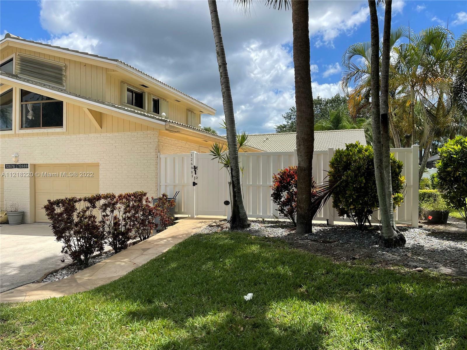 Property Photo:  12688 Woodmill Dr  FL 33418 