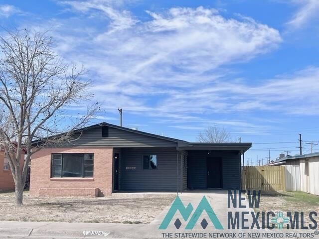 Property Photo:  1304 W Champ Clark Avenue  NM 88210 