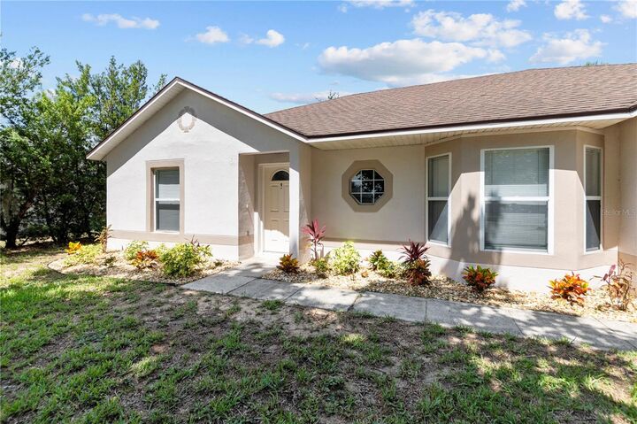 Property Photo:  335 Pebble Court  FL 34715 
