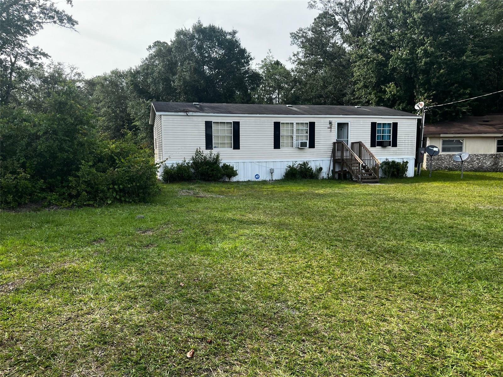 Property Photo:  13412 NE Waldo Road  FL 32609 