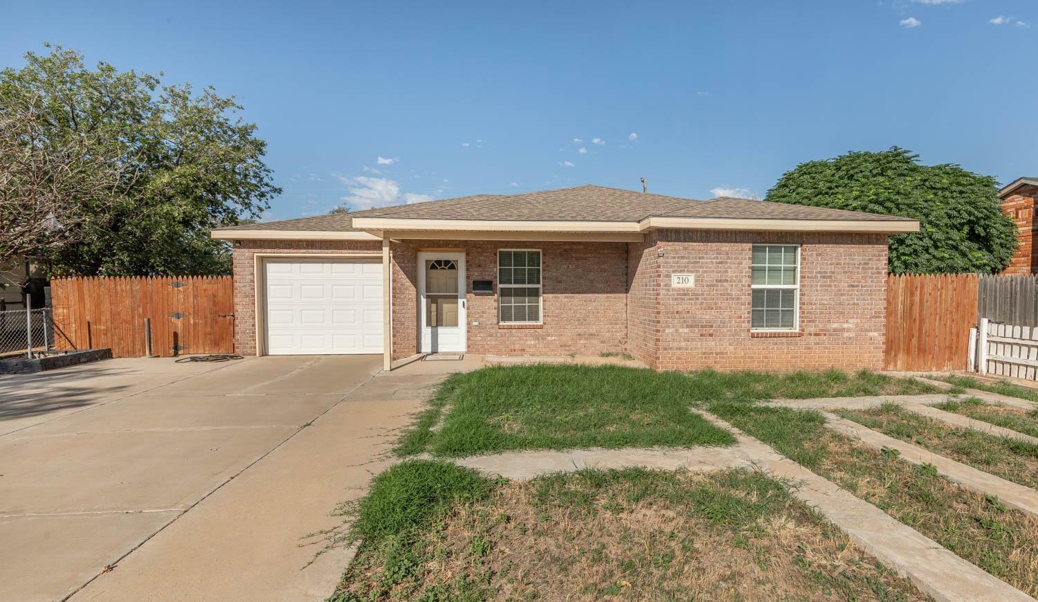 Property Photo:  210 Ave S  TX 79415 