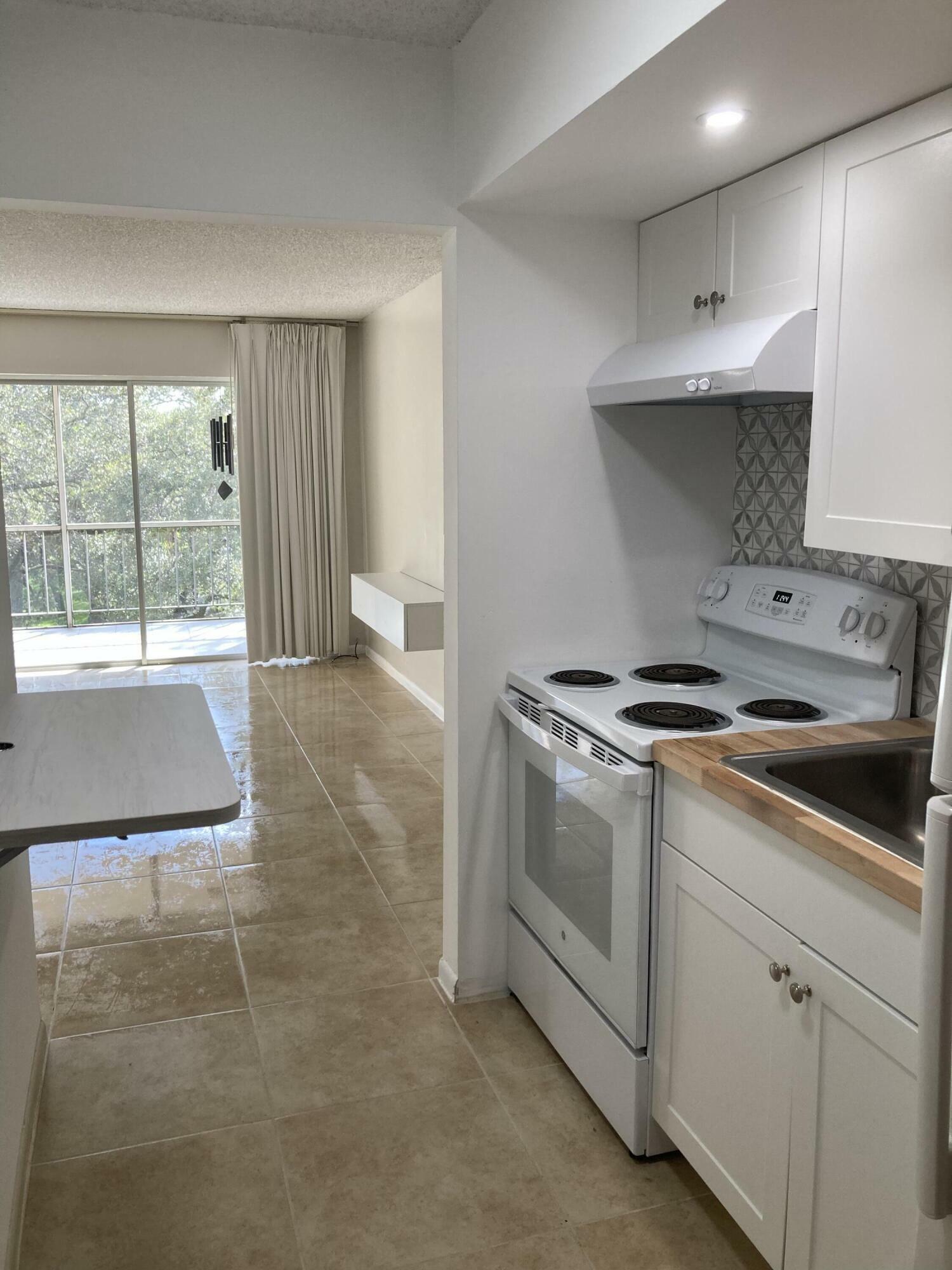 Property Photo:  644 NW 13th Street 32  FL 33486 