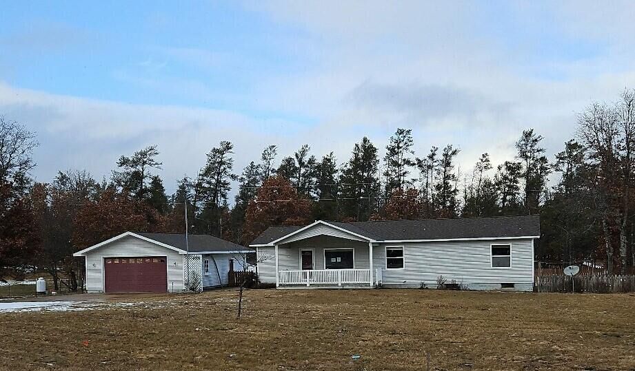 Property Photo:  255 M-72  MI 49738 