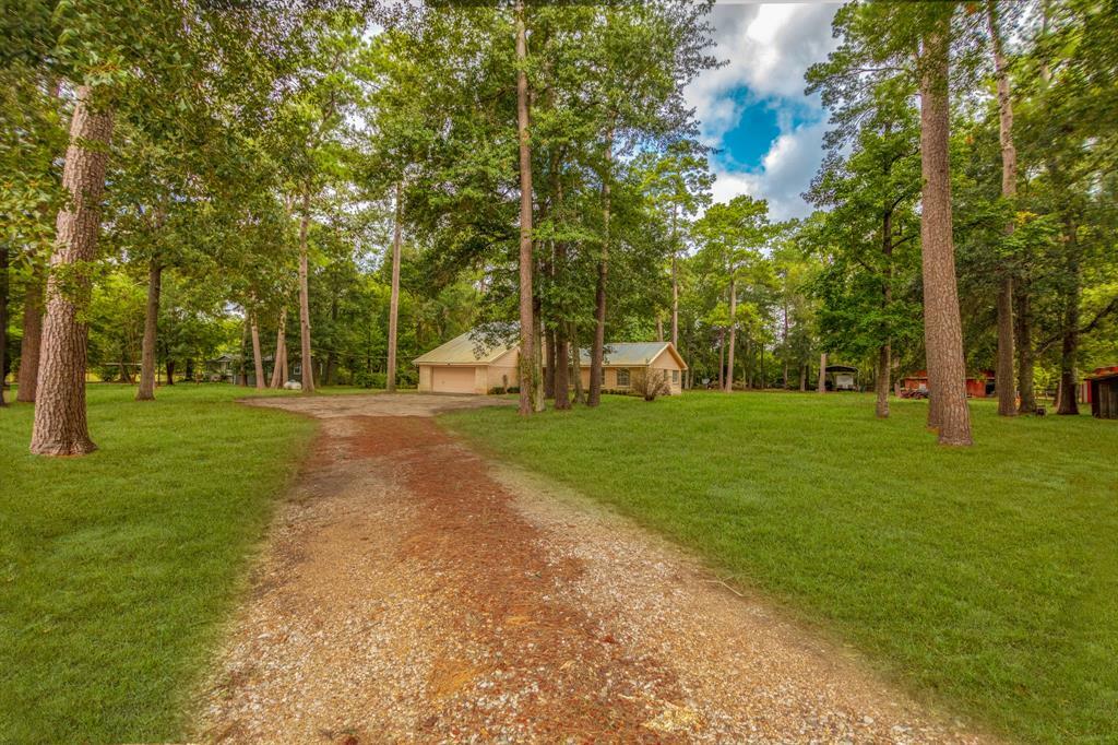 Property Photo:  242 County Road 2198  TX 77327 