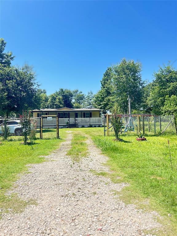 Property Photo:  2324 County Road 3405  TX 77327 