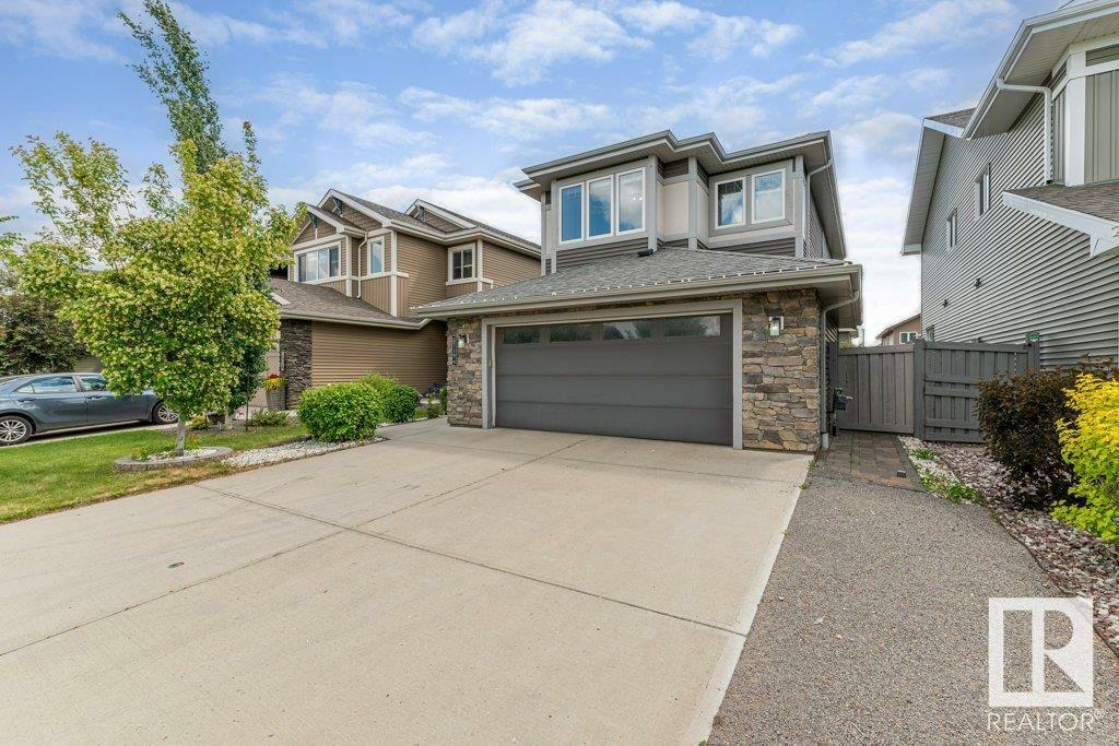 Property Photo:  8719 218 Street NW  AB T5T 4R7 