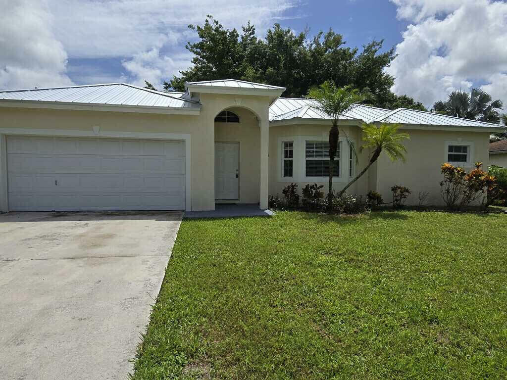 Property Photo:  1933 SE Cheltenham Street  FL 34983 