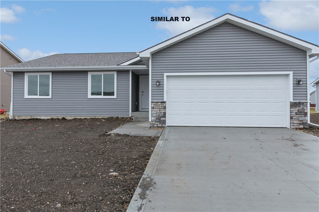 Property Photo:  322 NE Driftwood Street  IA 50073 