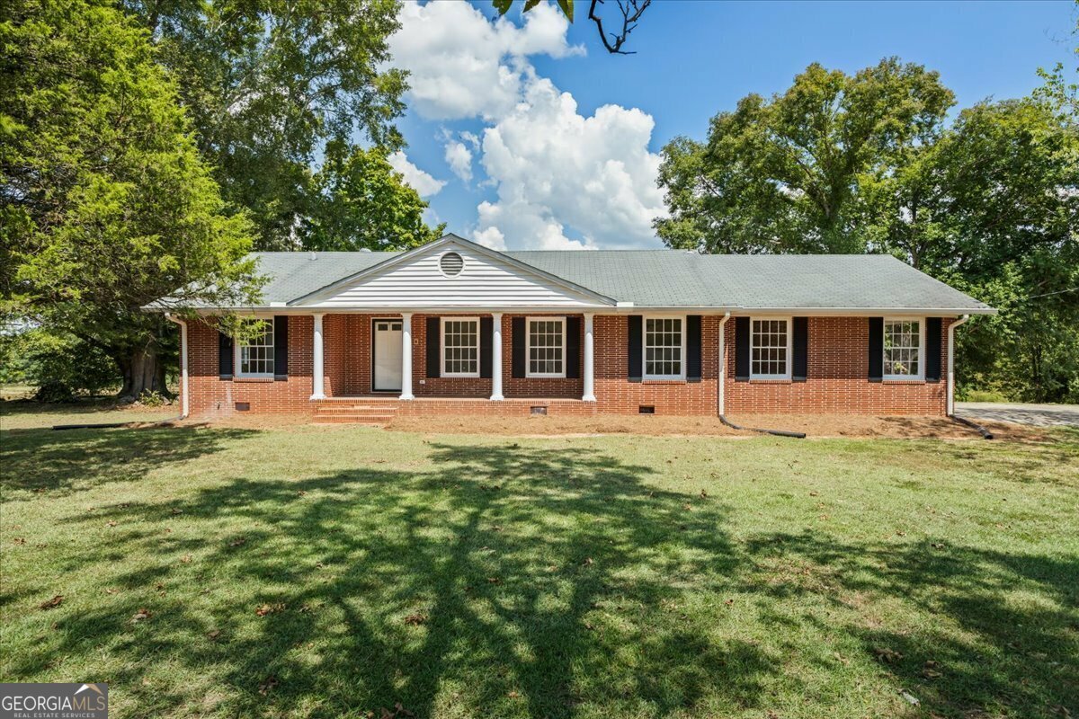 Property Photo:  619 East Lake Road  GA 30252 