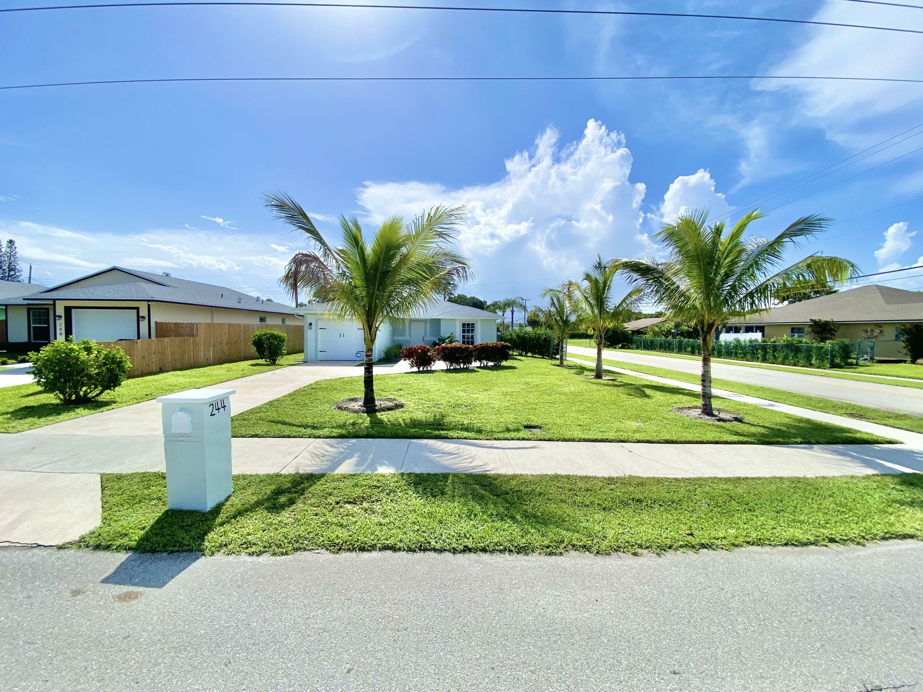 Property Photo:  244 NW 6th Avenue  FL 33444 