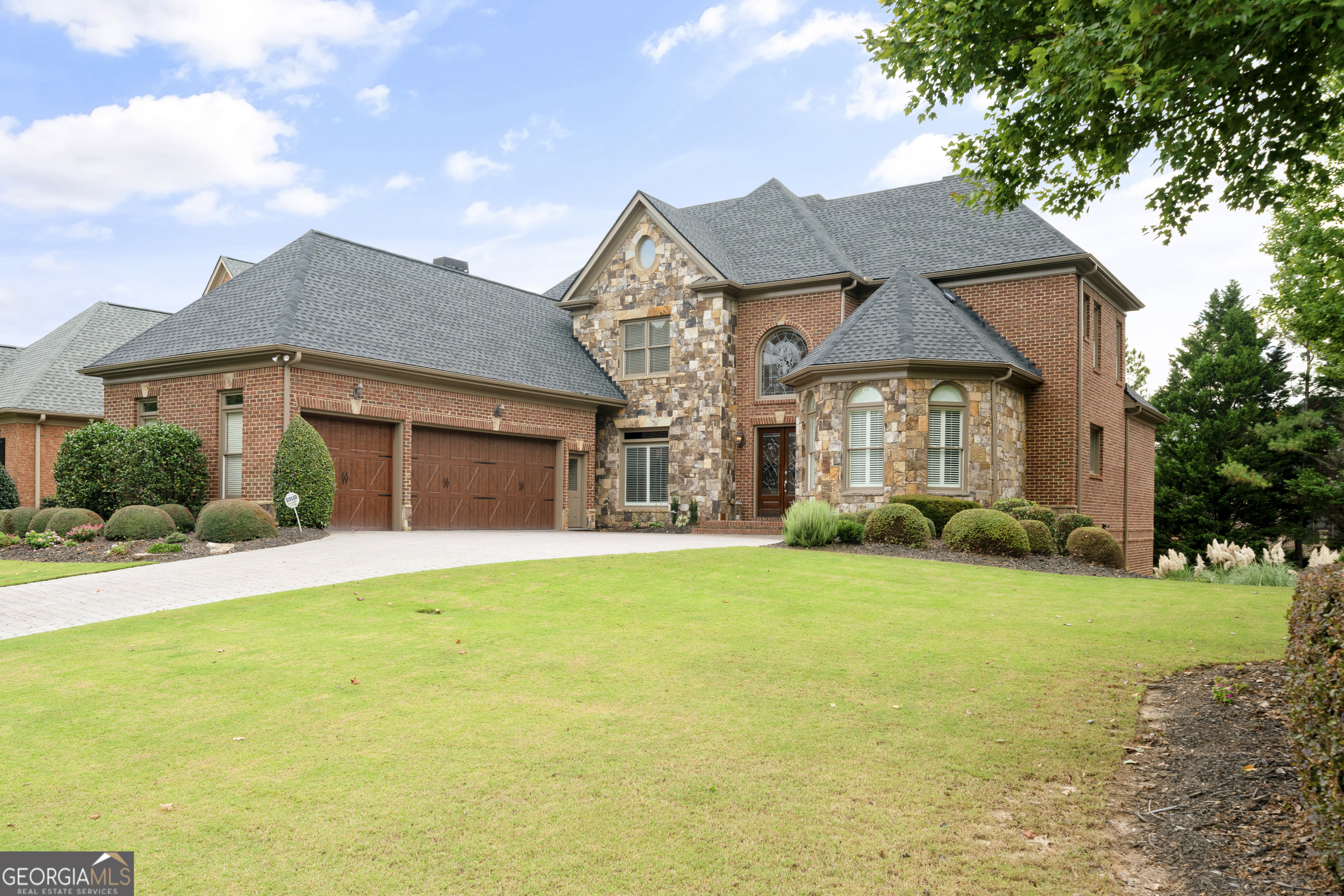 Property Photo:  8295 Royal Melbourne Way  GA 30097 