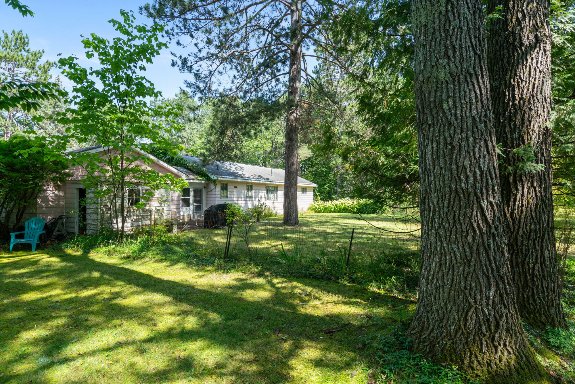 Property Photo:  6853 Fisher Woods Road  MI 49749 