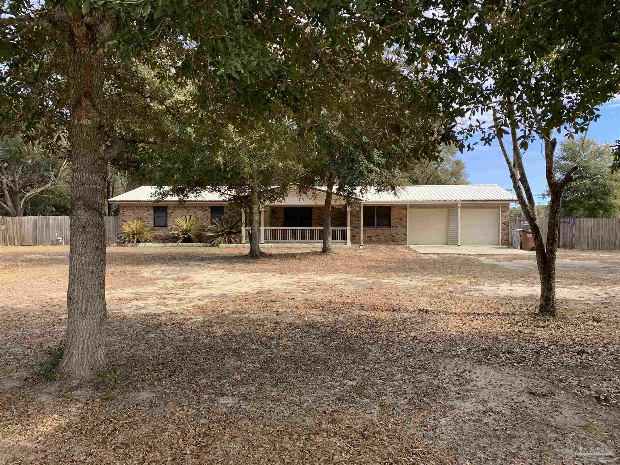 Property Photo: 6260 Pansy Dr FL 32570