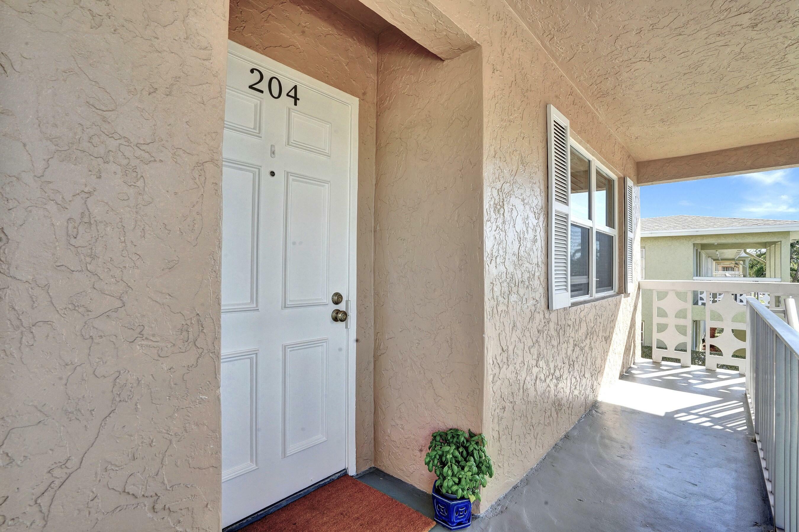 Property Photo:  1100 Mahogany Way 204  FL 33445 