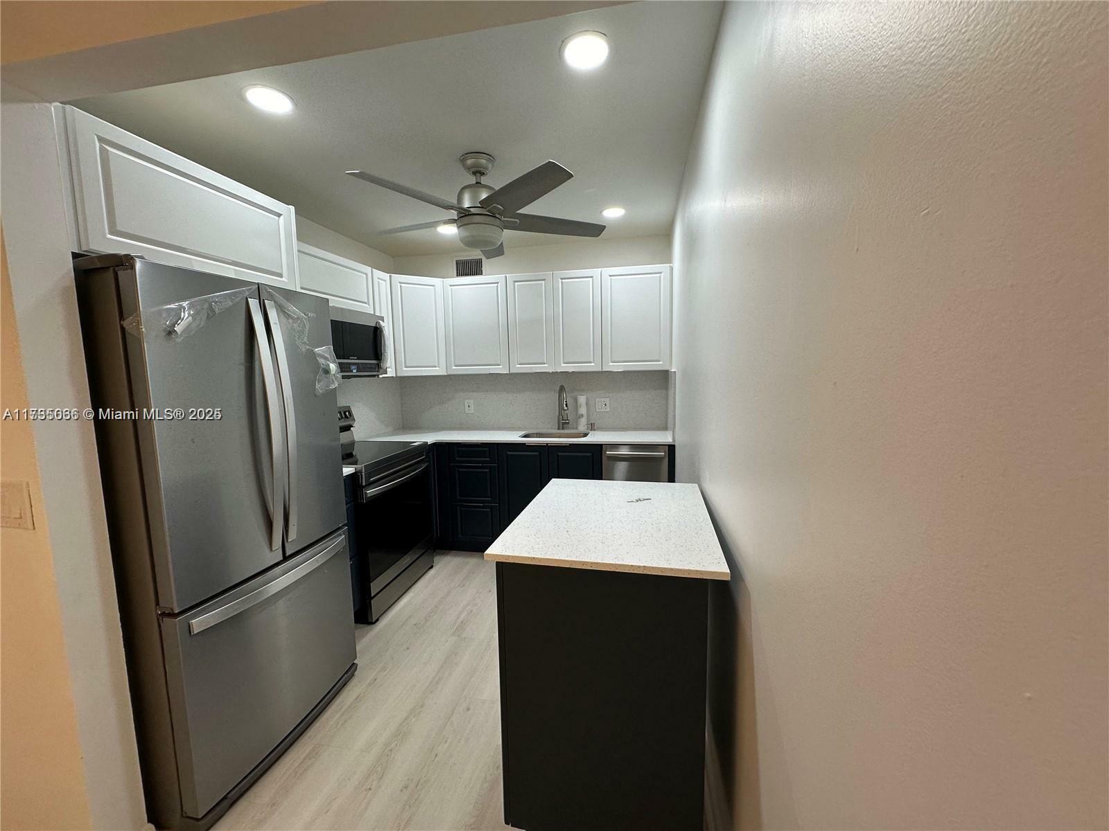 Property Photo:  850 SW 133rd Ter 405B  FL 33027 