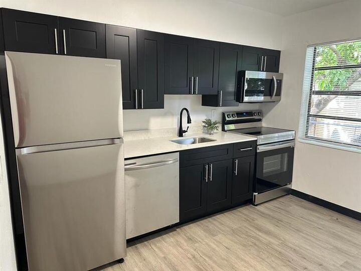 Property Photo: 725 NW 1st Ct FL 33009