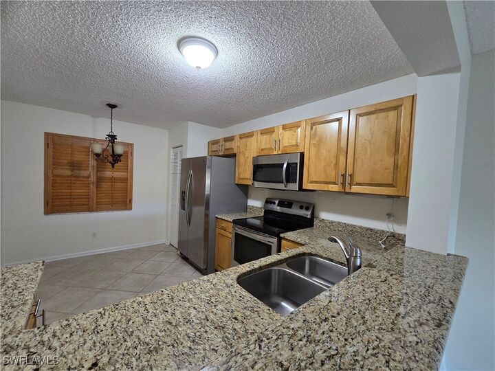 Property Photo: 5737 Whitaker Road C104 FL 34112