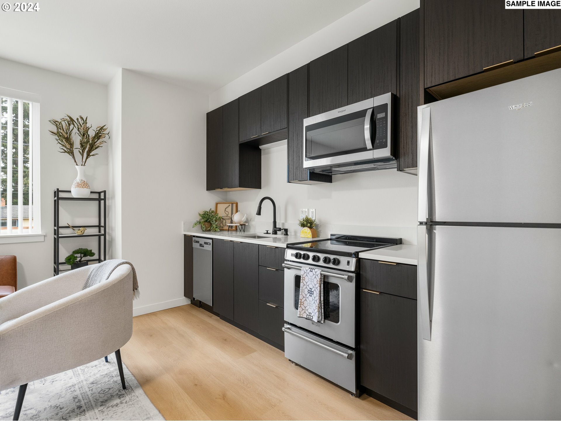 Property Photo: 10985 E Burnside St 26 OR 97216