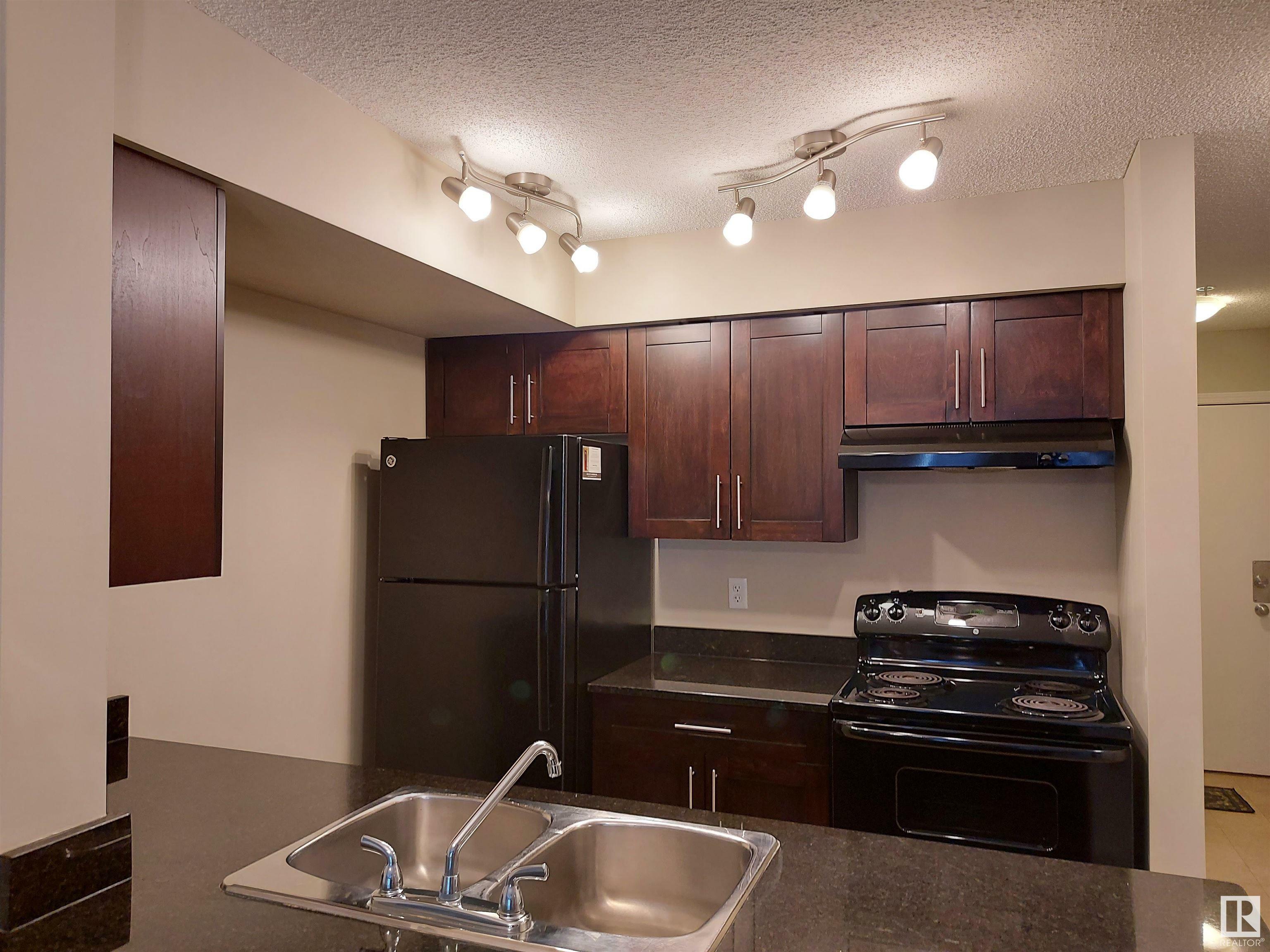 Property Photo: 12035 22 Avenue SW 103 AB T6W 2X9