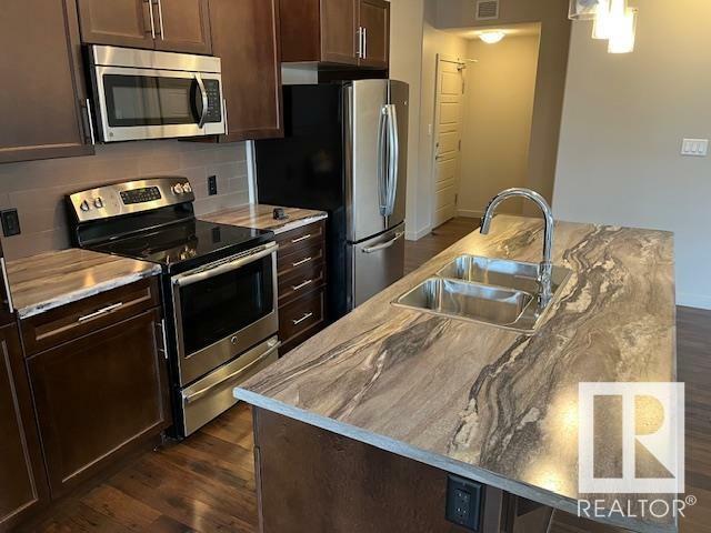 Property Photo: 507 Albany Way NW 201 AB T6V 0L9