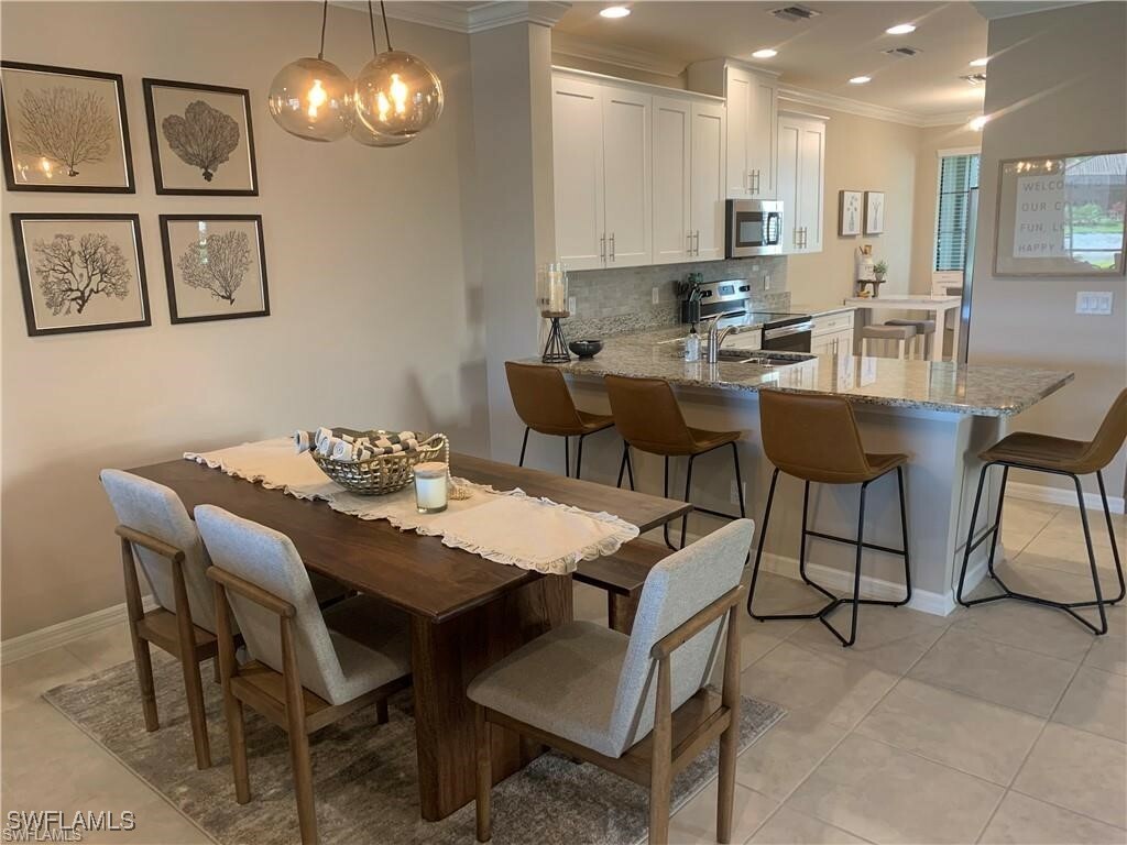 Property Photo: 9433 Benvenuto Court 5-101 FL 34119