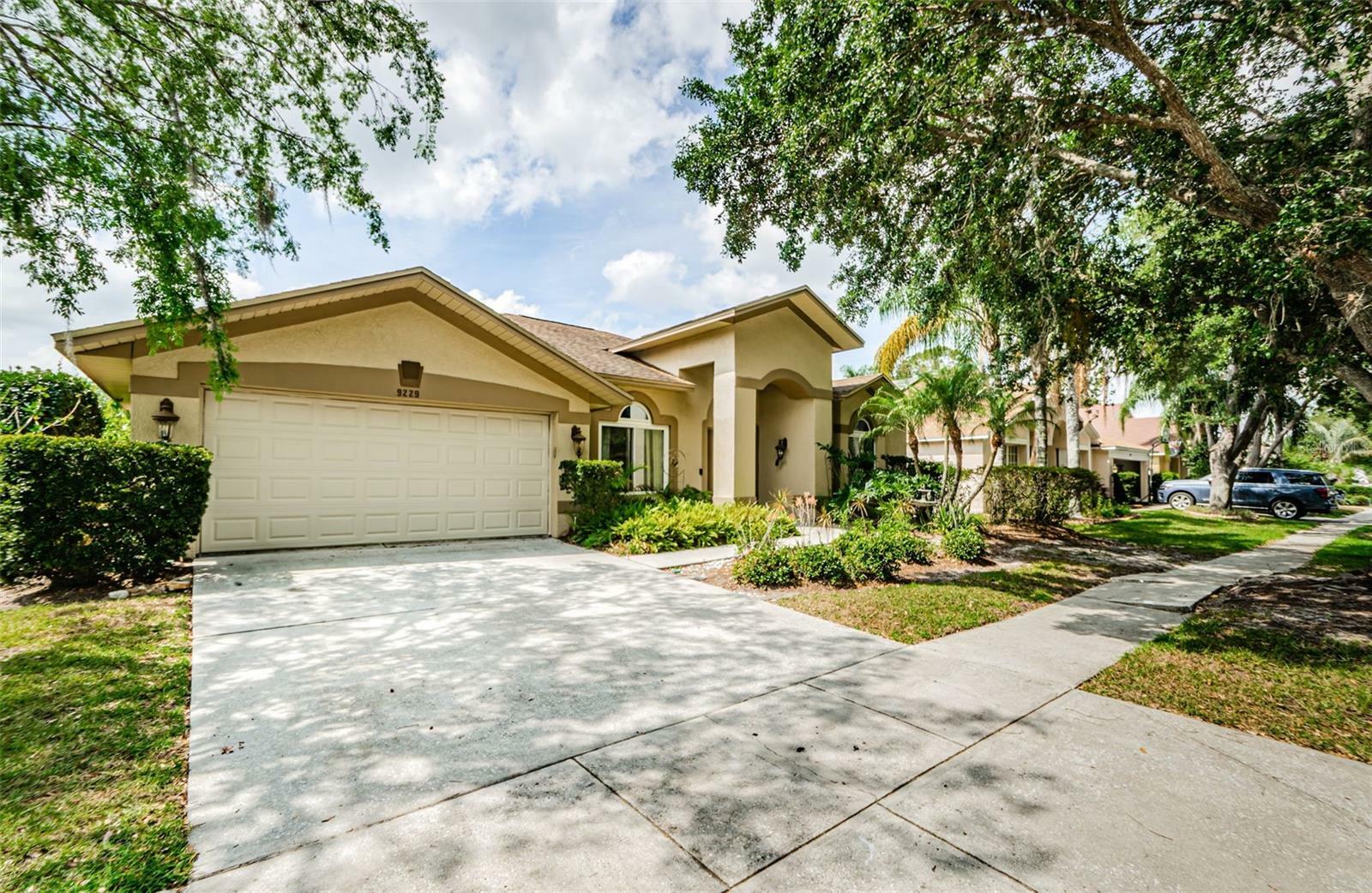 Property Photo: 9229 Dayflower Drive FL 33647