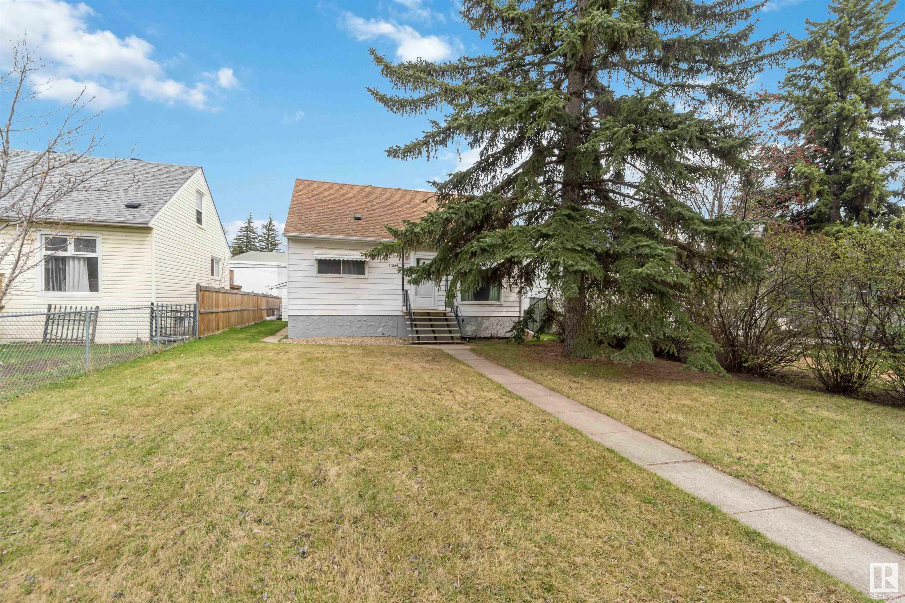Property Photo: 11539 St Albert Trail NW AB T5M 3L4