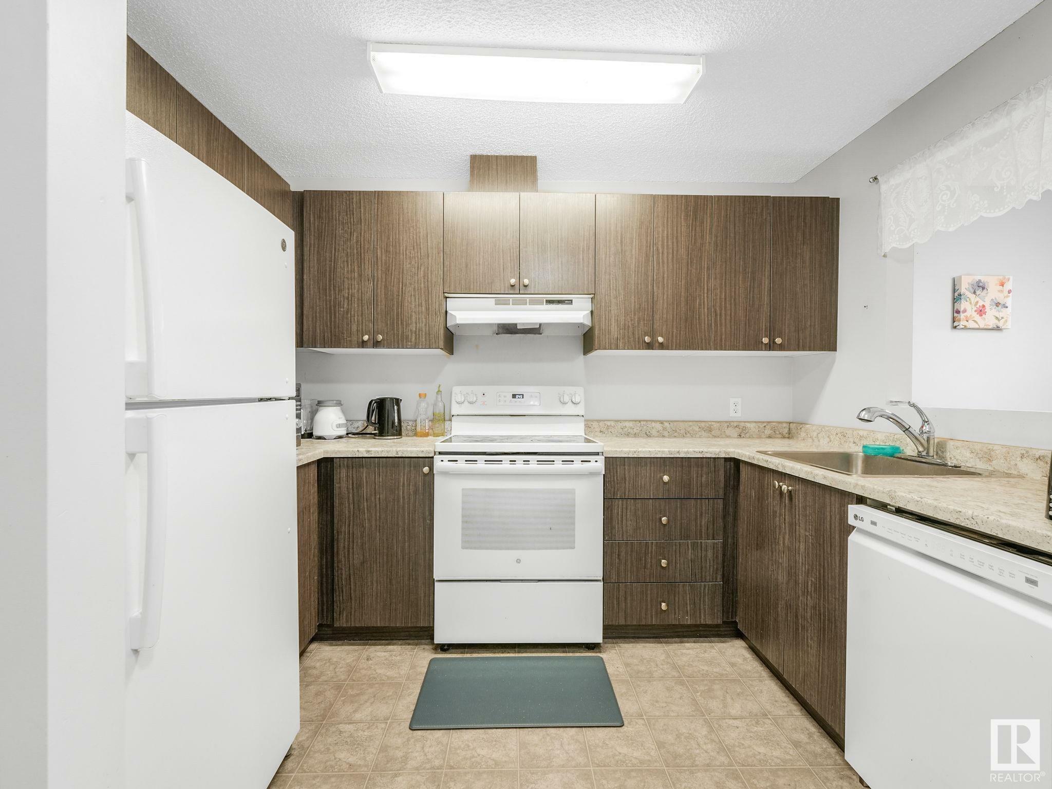 Property Photo: 14808 26 Street NW 402 AB T5Y 2G4