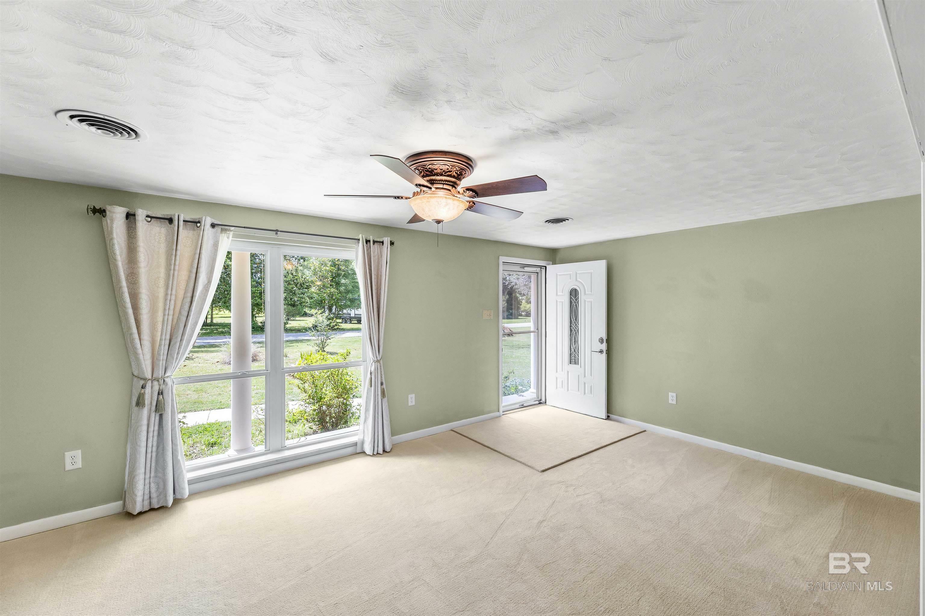 Property Photo: 7410 Helton Drive AL 36535