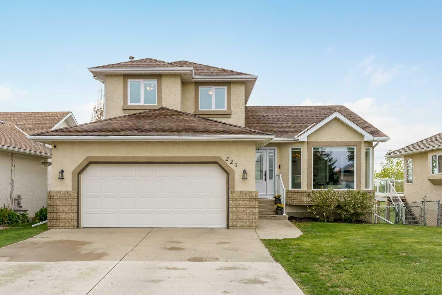 Property Photo: 220 Lakeside Greens Drive AB T1X 1C5