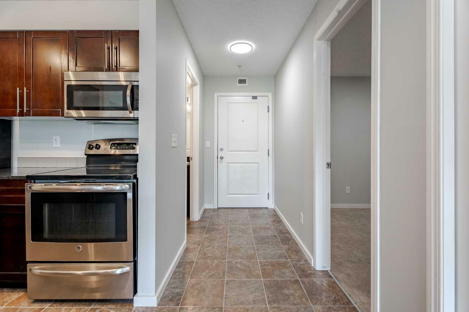 Property Photo: 403 Mackenzie Way SW 8307 AB T4B 3V7