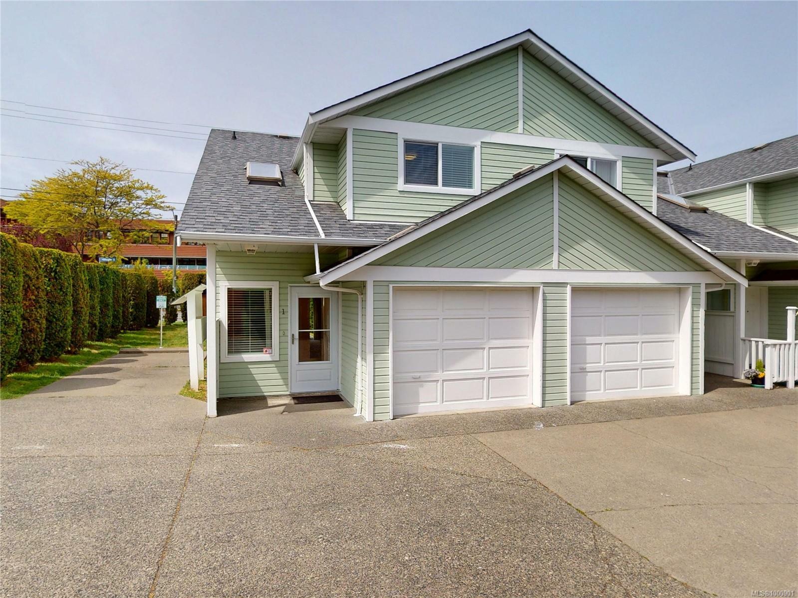 Property Photo: 1441 Hillside Ave 1 BC V8T 2B9