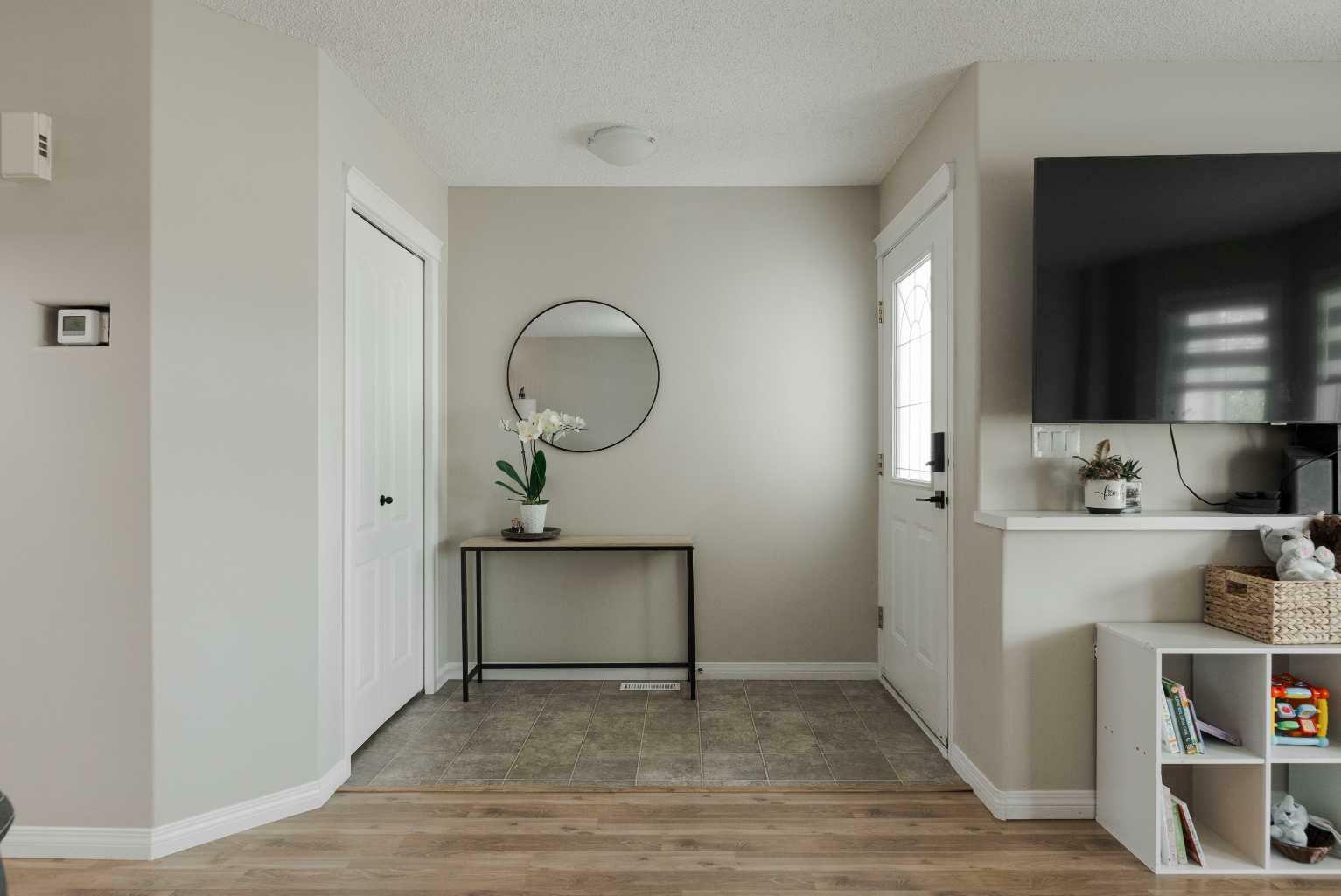 Property Photo: 208 Diefenbaker Drive AB T9K 2J9