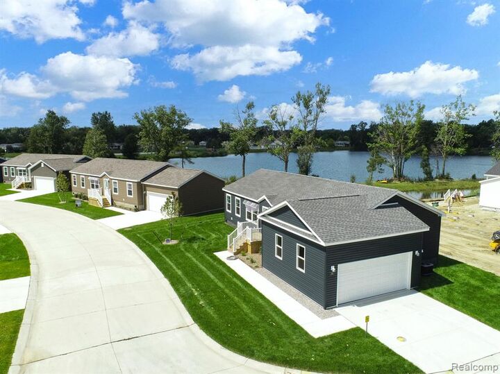 Property Photo: 202 Riviera Drive MI 48446