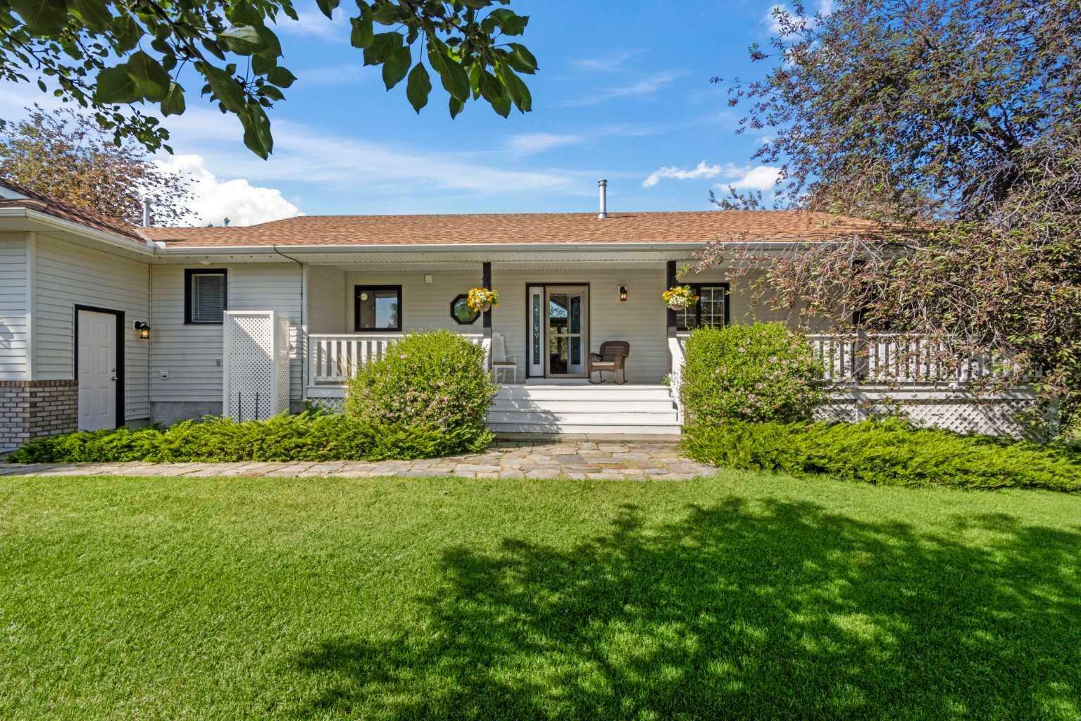 Property Photo: 80057 Highwood Meadows Drive E AB T1S 4Y9