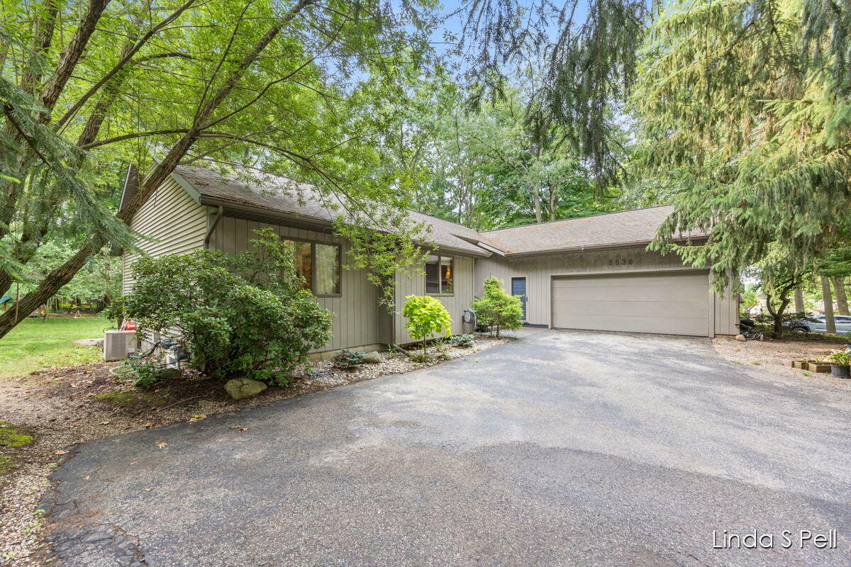 Property Photo: 6636 E Riverwoods Court NE MI 49341
