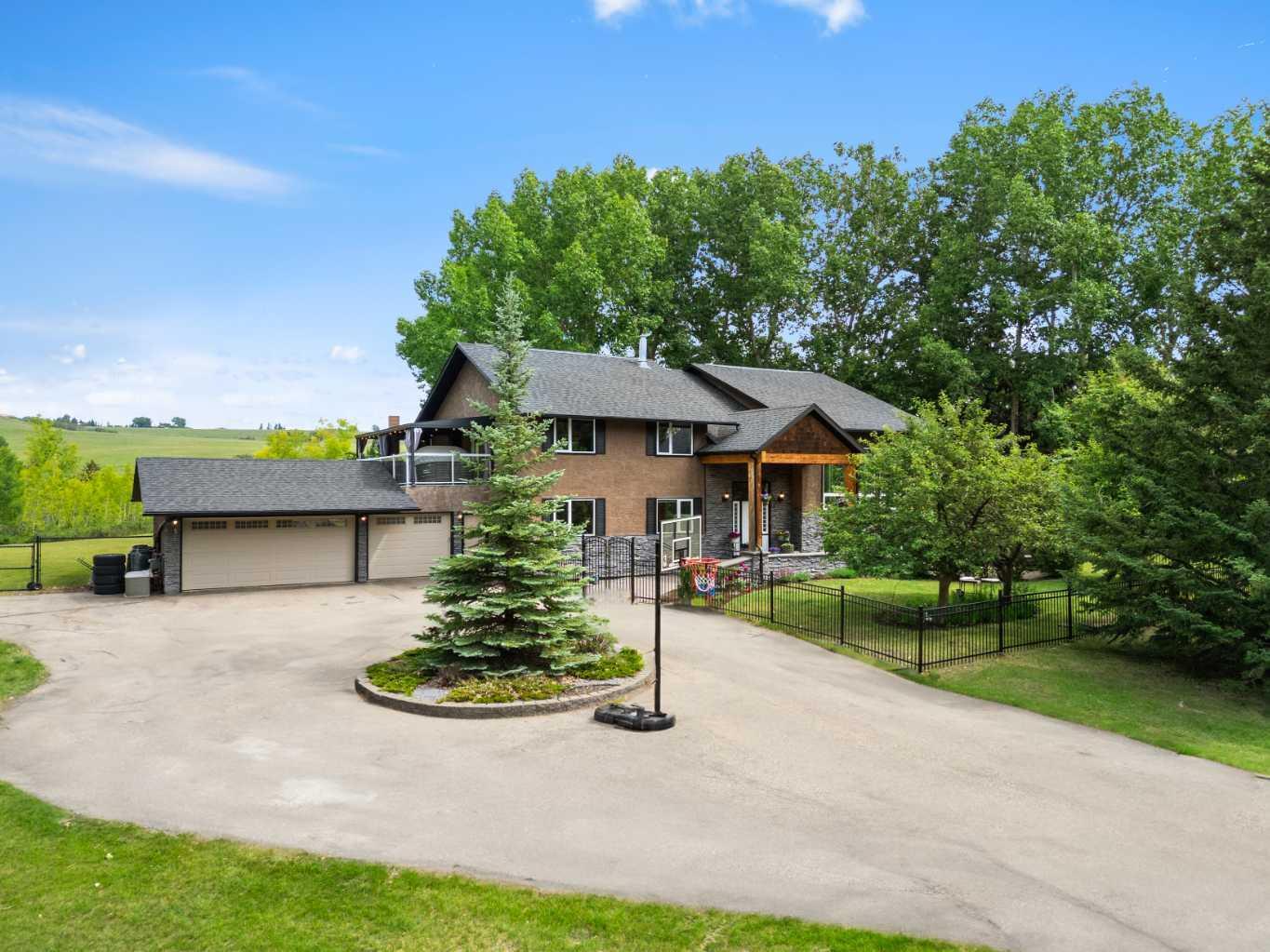 Property Photo: 502 Bearspaw Village Ridge AB T3L 3P1