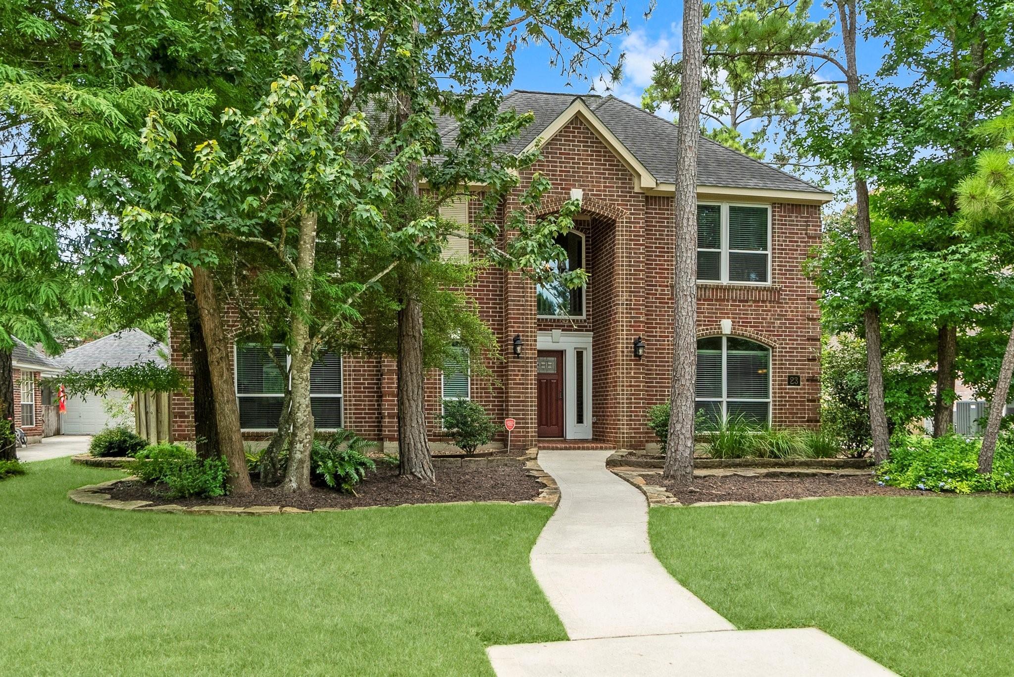 Property Photo: 23 Sparklewood Place TX 77381