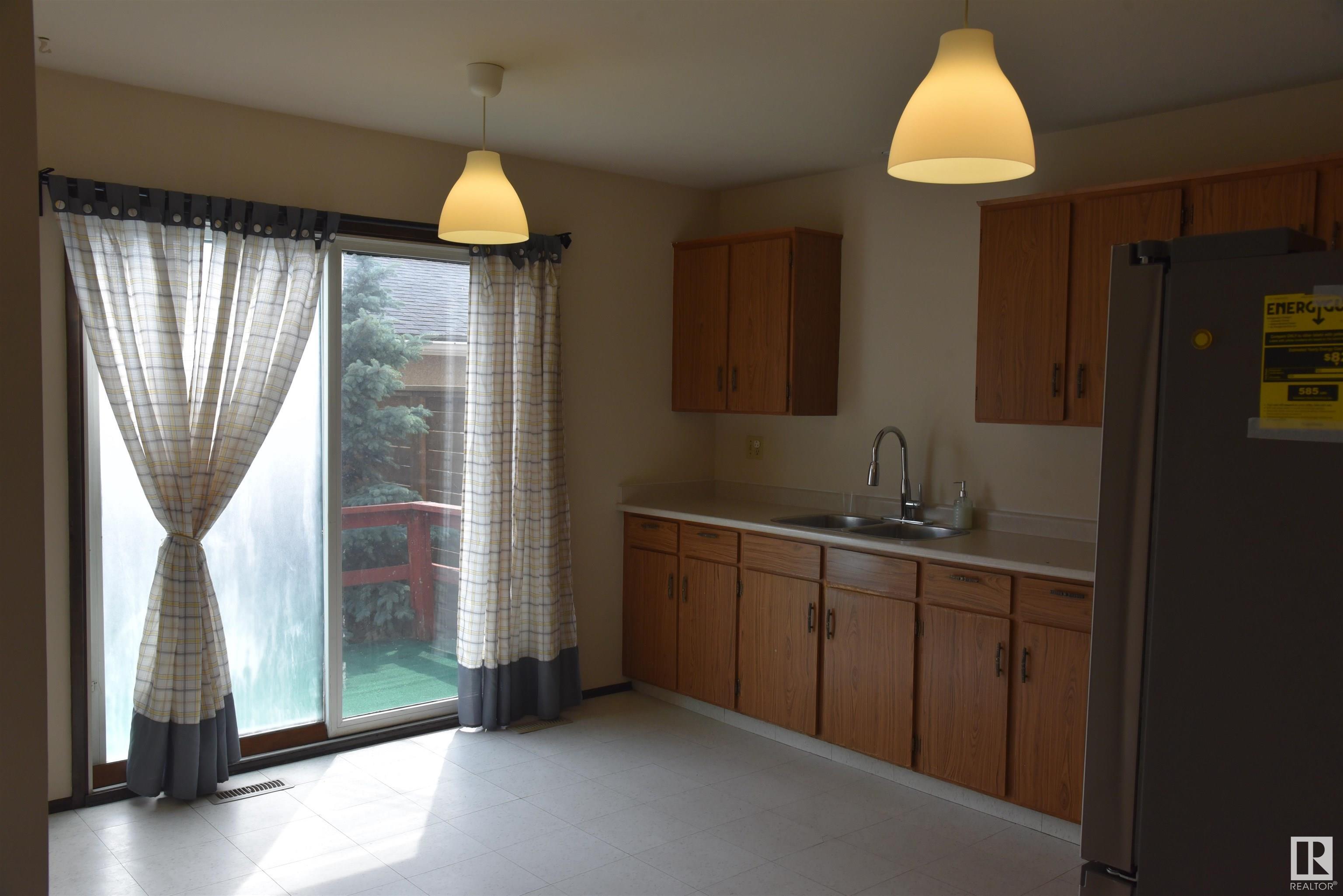 Property Photo:  7015 101 Avenue NW  AB T6A 0H6 