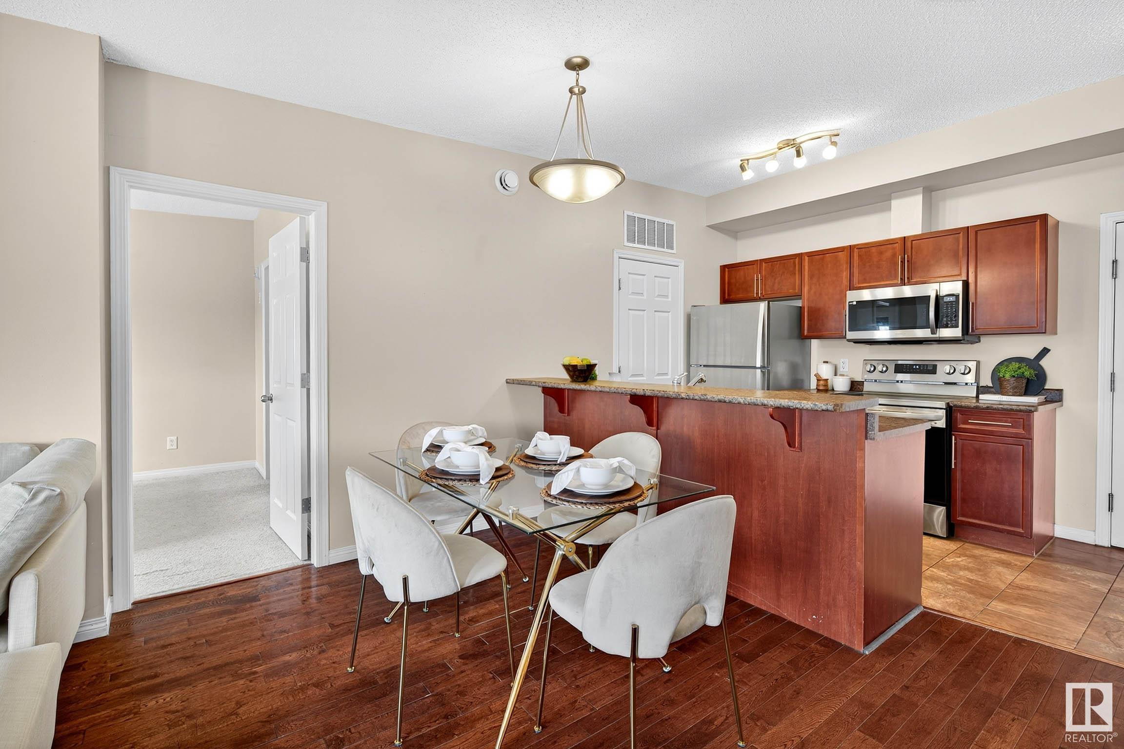 Property Photo:  6925 199 Street NW 401  AB T5T 3X8 