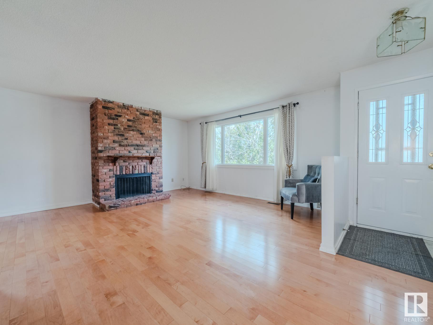 Property Photo:  4705 128A Avenue NW  AB T5A 2J4 