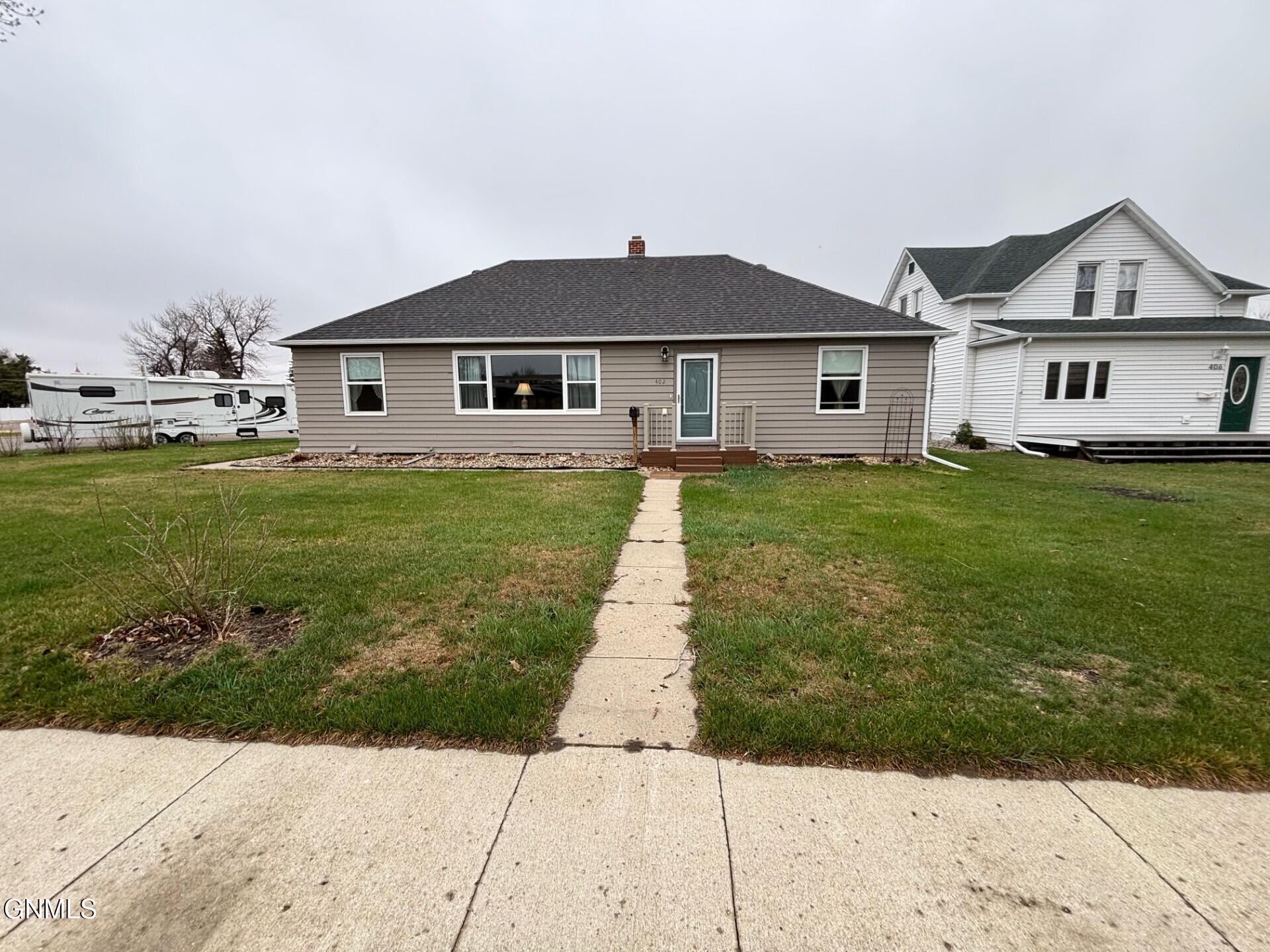 Property Photo:  402 Brewster Street E  ND 58341 